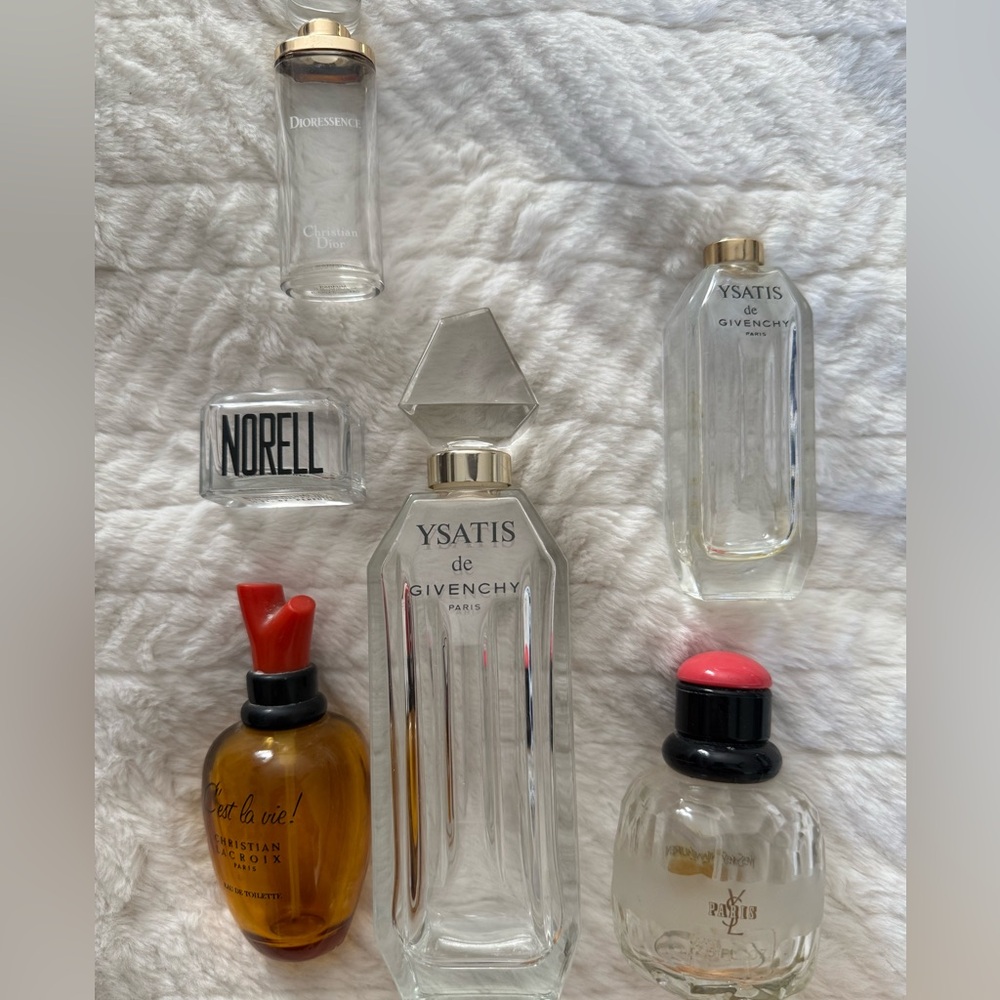 Collection of vintage empty perfume bottles. Christian Lacroix, YSL etc.